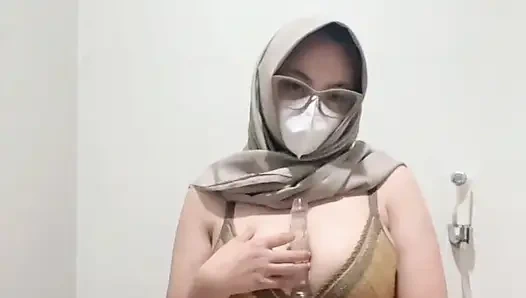 Brutal busty girl in bikini masturbates using squirt tipped dildo