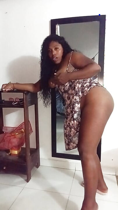 My neighbor welcomes me in a mini dress