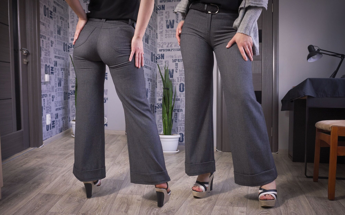 Sekreter dar pantolonlu bacakları ve götünü modelliyor
