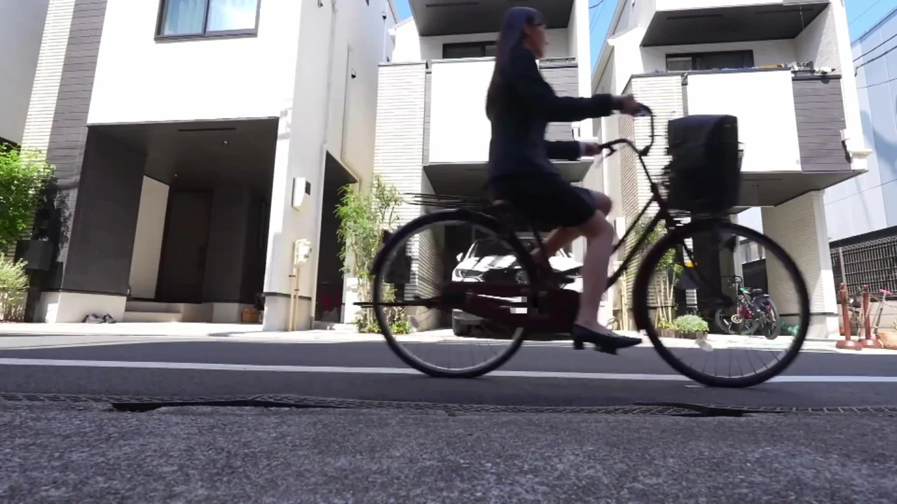 Playing a prank on the bicycle saddle of a beautiful, big-buttocked office