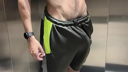 Hairy fitness guy showing off his thick cock in the elevator without underwear