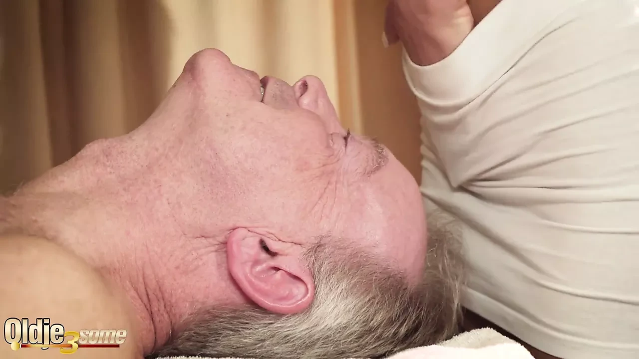 Old man gets oil massage from two beautiful teen girls