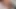 Kırmızı renkli saçlı travesti cama işiyor