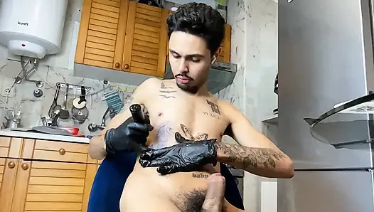 Skinny guy with a big, thick dick getting a tattoo and then jerking off.