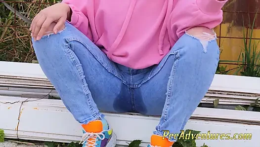 Hipster girl pee in her jeans - changing her wet shorts into dry pants
